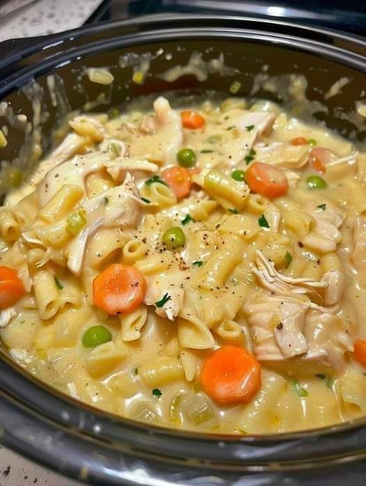 Skillet dish with chicken, noodles, and vegetables.